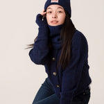 Side view of inky blue rib knit alpaca beanie showing soft texture