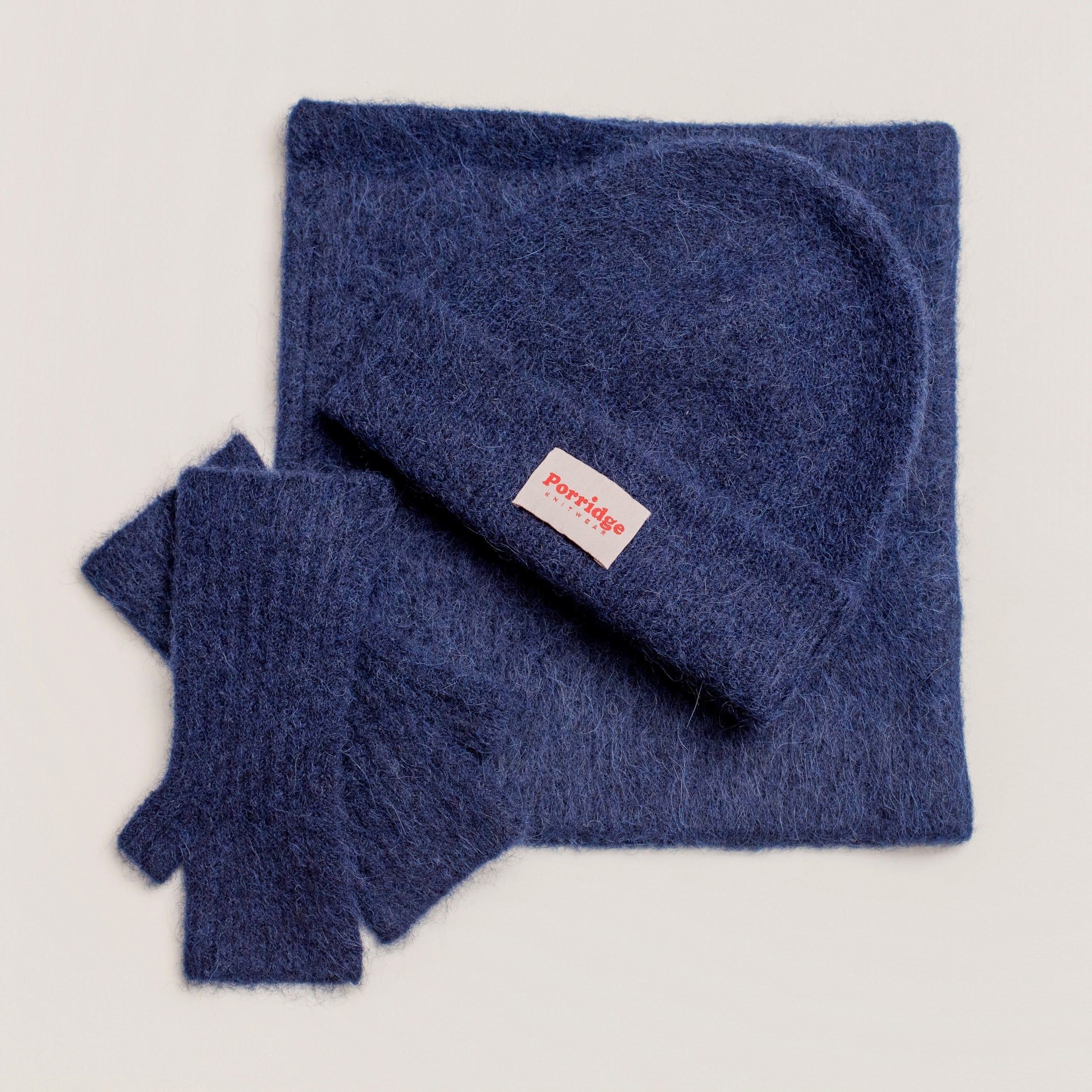 Close-up of alpaca wool beanie in inky blue showing fluffy knit detail