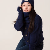 Side view of inky blue rib knit alpaca beanie showing soft texture