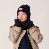 Close-up of navy ribbed knit cashmere beanie with smooth finish