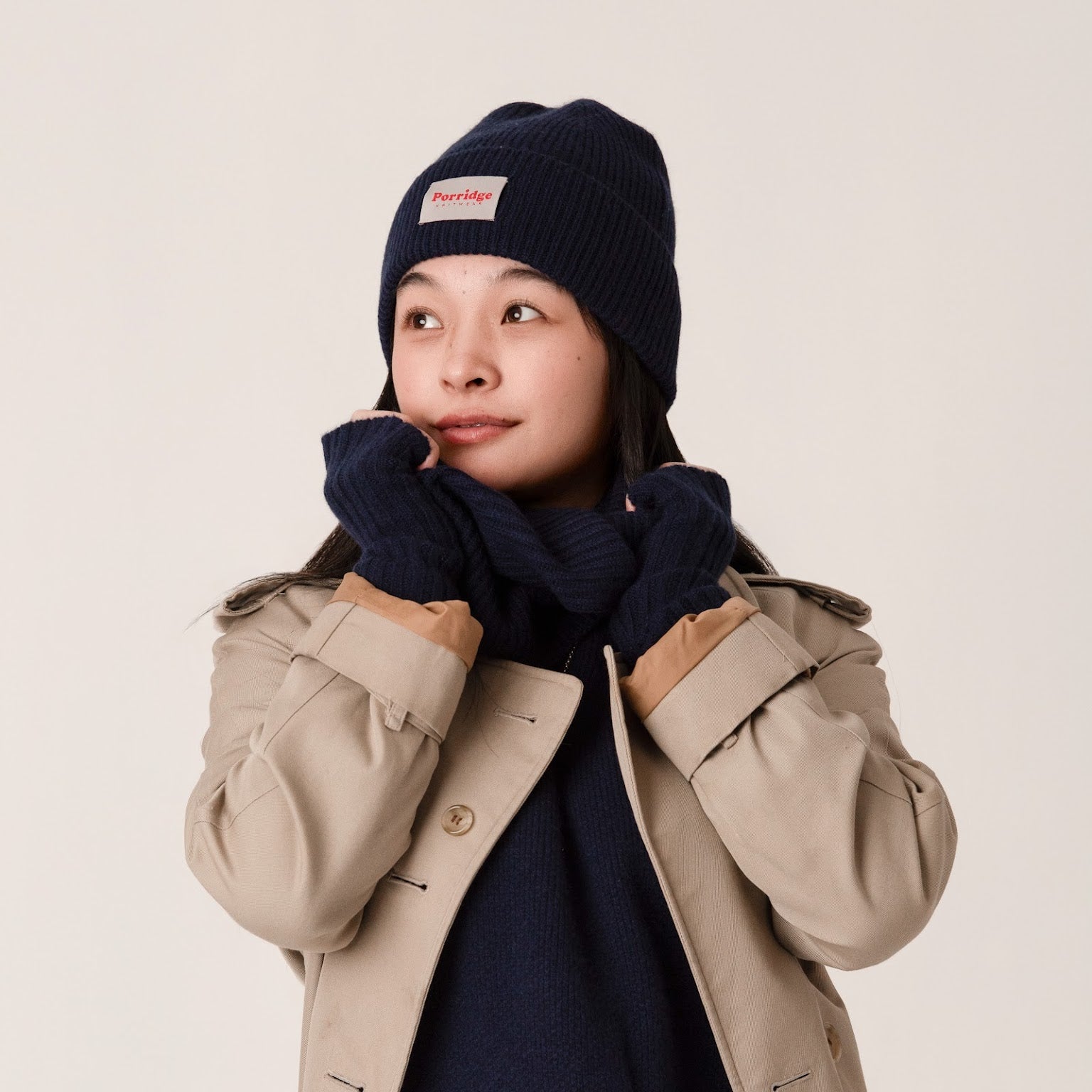Close-up of navy ribbed knit cashmere beanie with smooth finish