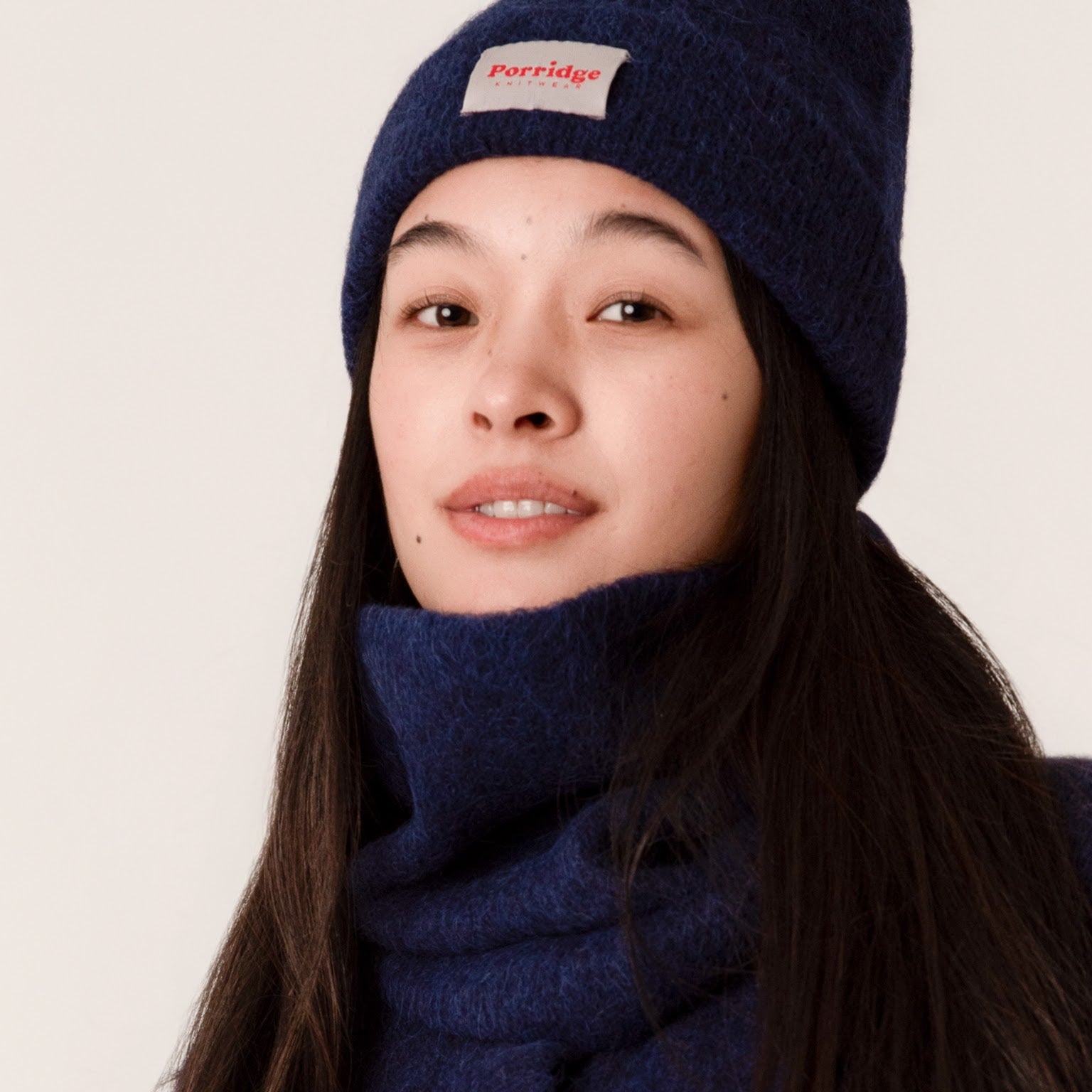 Soft rib knit alpaca snood in inky blue, winter accessory close-up