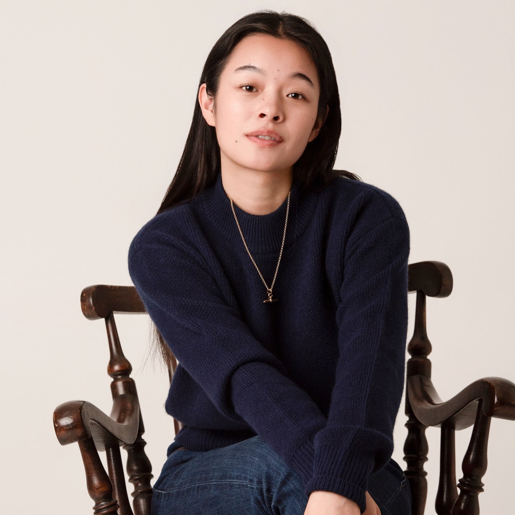 Wool cashmere cropped jumper in admiralty navy showing ribbed roll neck