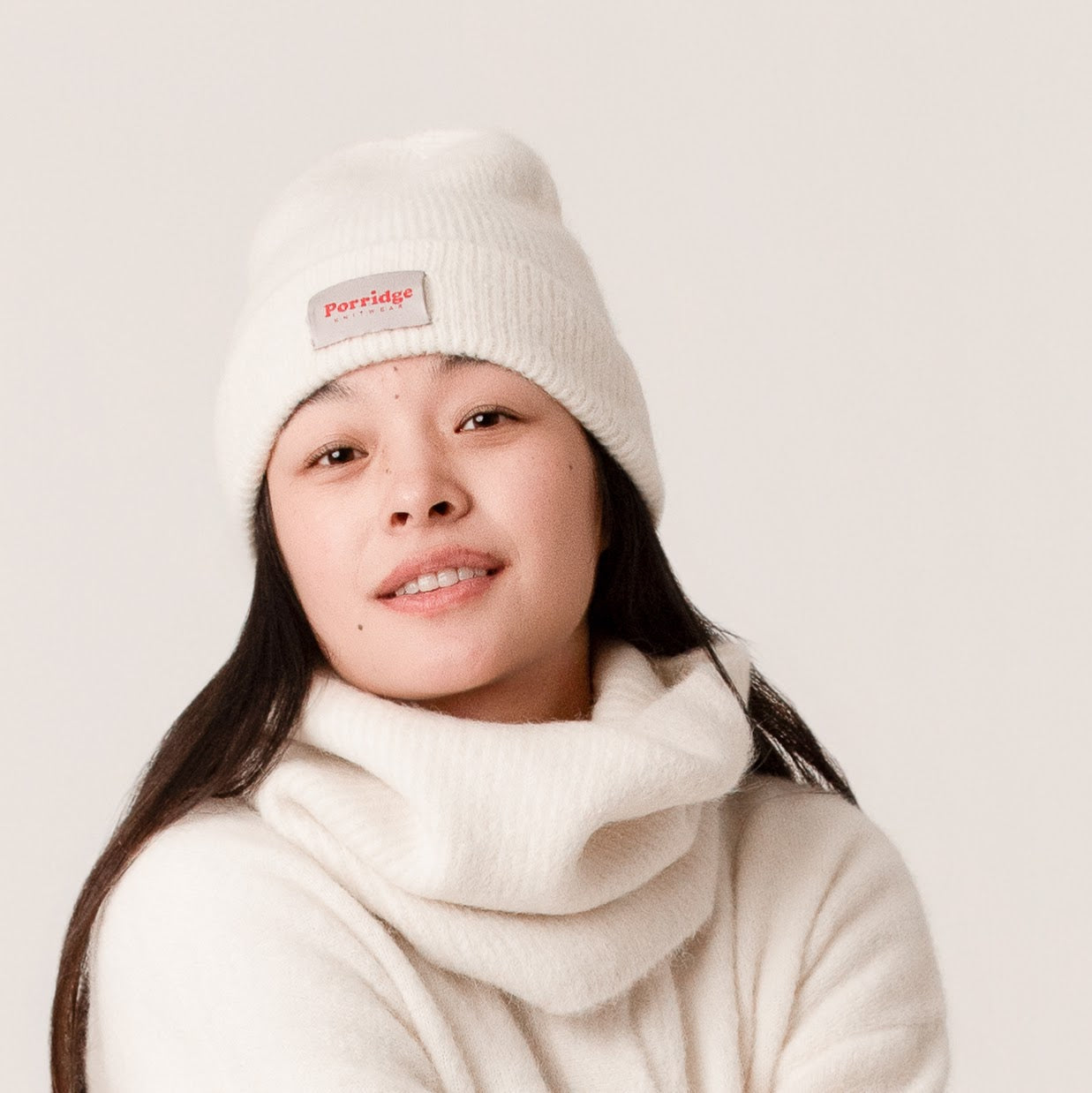Cosy white beanie made from soft alpaca wool with ribbed texture
