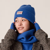 Side view of blue rib knit cashmere beanie showing thick knit texture