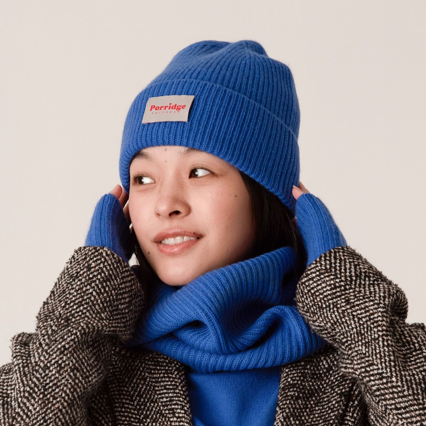 Side view of blue rib knit cashmere beanie showing thick knit texture