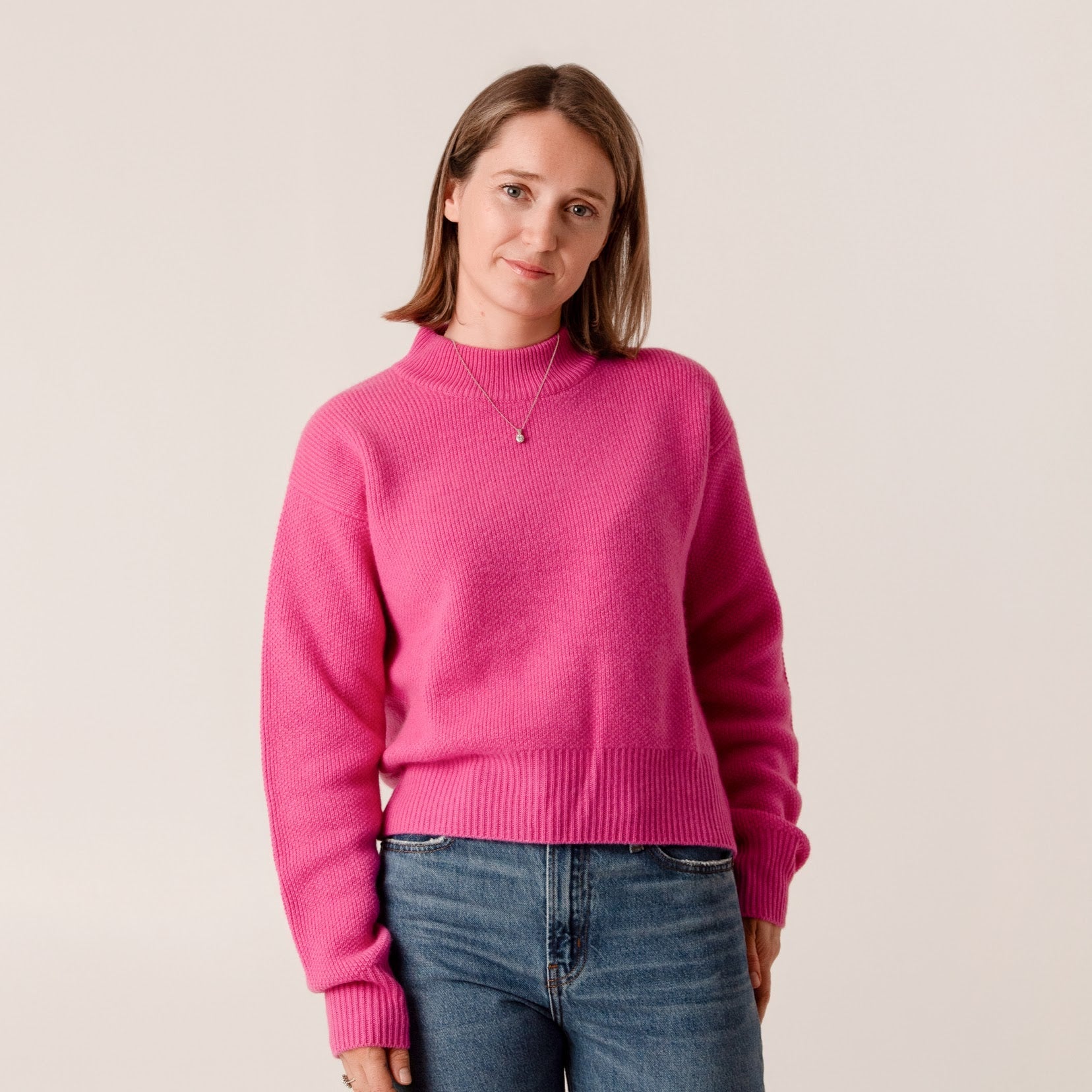 Soft pink cropped roll neck jumper in chunky rib knit wool cashmere blend