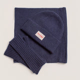Navy cashmere beanie showing chunky rib texture and soft wool blend