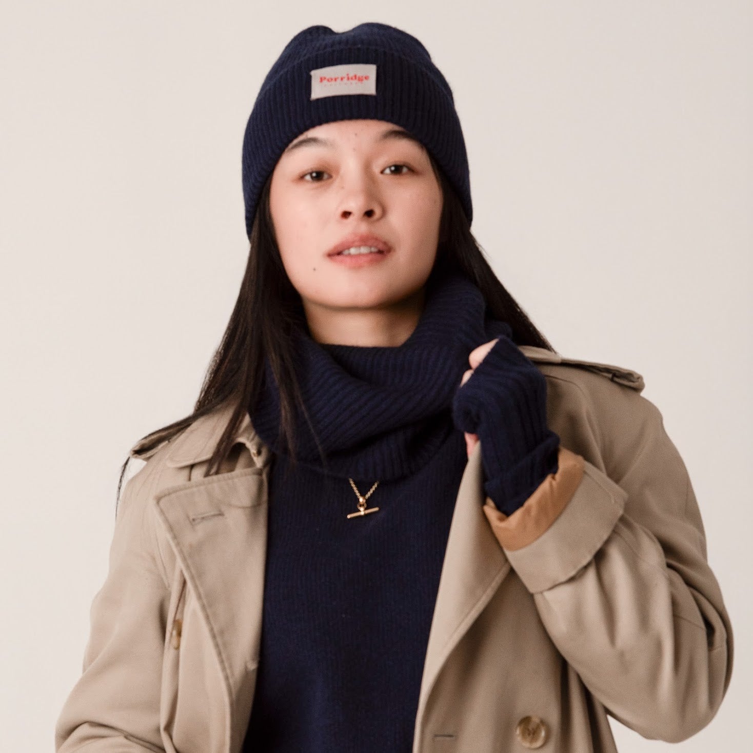 Side angle of navy cashmere beanie showing soft rib knit detail