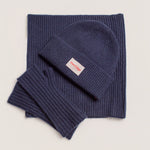 Navy cashmere beanie showing chunky rib texture and soft wool blend