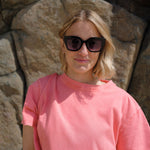 Colourful black sunglasses with coloured lenses and stylish design.