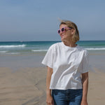Colourful sunglasses in bright pink with bold frames and stylish design.