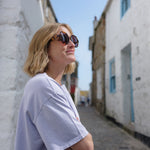 Three-quarter view of tortoise shell sunglasses emphasizing the rich pattern.
