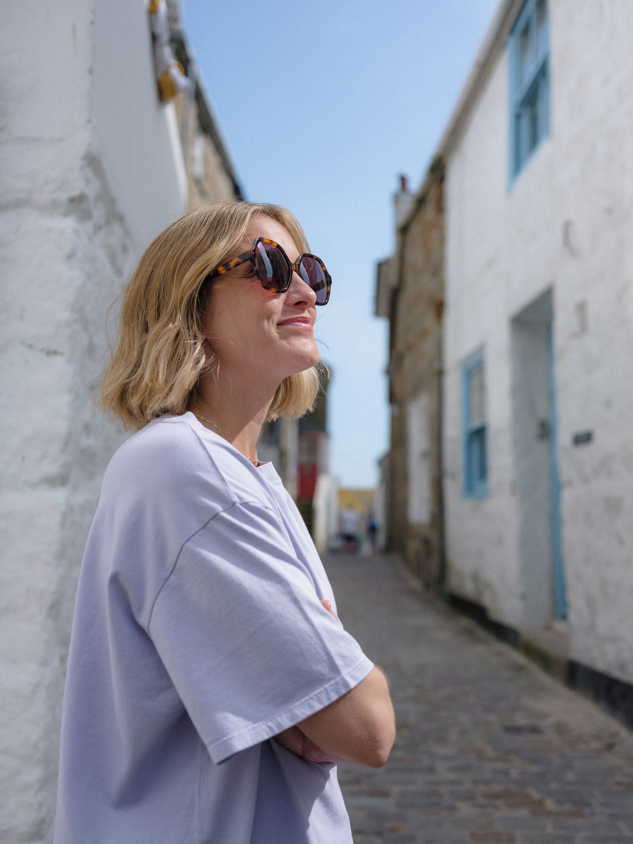 Three-quarter view of tortoise shell sunglasses emphasizing the rich pattern.