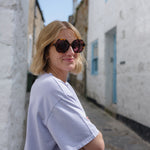 Tortoise shell glasses with stylish rounded frames in classic tortoiseshell pattern.