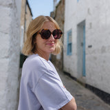 Tortoise shell glasses with stylish rounded frames in classic tortoiseshell pattern.