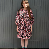 women wearing pink leopard dress
