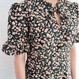 Deadstock floral cotton mini dress designed by The Well Worn for a bold, feminine look.