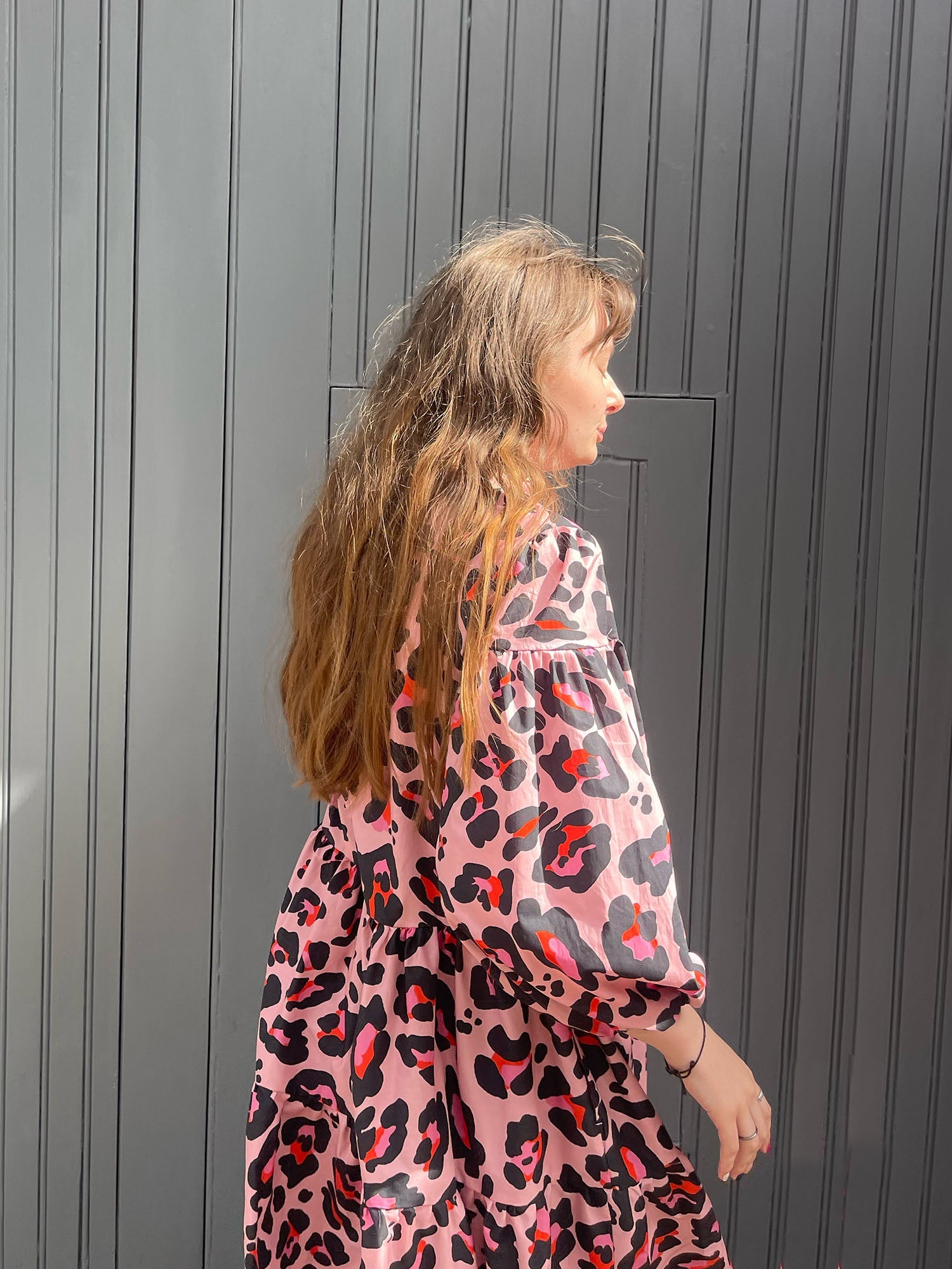women wearing pink leopard dress details
