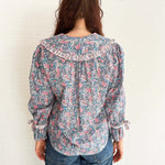 Romantic and effortless – model in lightweight floral print blouse made in the UK