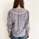 Romantic and effortless – model in lightweight floral print blouse made in the UK
