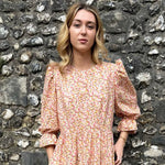 Close-up of The Grace Dress – Confetti Print midi dress with puff sleeves and elastic frill cuffs, handmade in the UK.