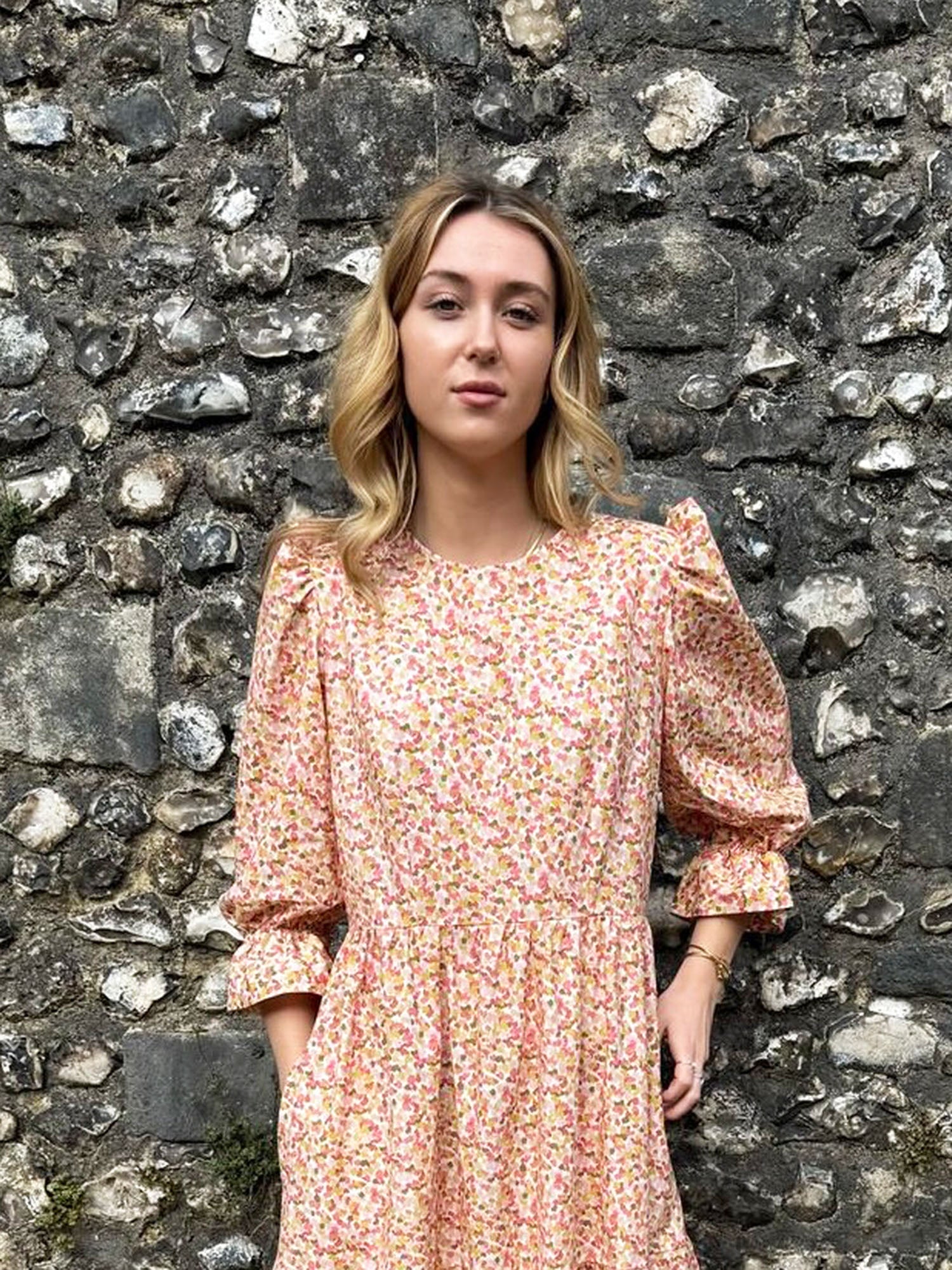 Close-up of The Grace Dress – Confetti Print midi dress with puff sleeves and elastic frill cuffs, handmade in the UK.
