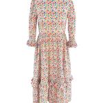 The Felicity Cotton Dress in Rainbow Meadow print, showcasing a vibrant floral design with ruffled details and 3/4 length sleeves.