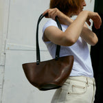 Spacious brown leather tote bag crafted from upcycled leather, ideal for everyday use