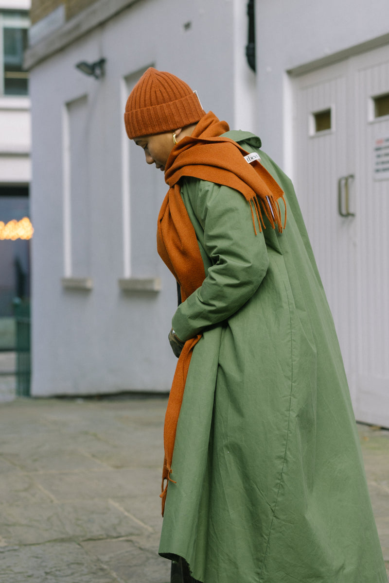 Waxed Cotton Asymmetric Raincoat in Olive by Lora Gene