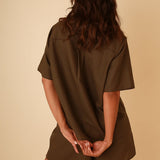 Outdoor look featuring short sleeve linen shirt and high waisted linen shorts two piece set.