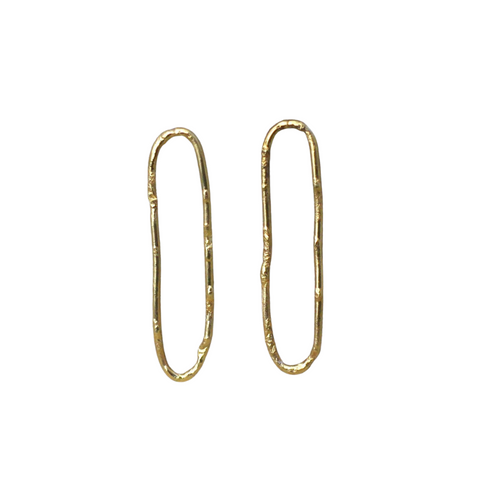 Textured loop earrings made out of fairmined gold vermeil by April March Jewellery. Inspired by ancient coins, keepsakes﻿ and tokens, each earring is melted, hammered and textured by hand to give them a unique character and charm. Fashioned into a quirky and stylish loop to create a unique look.   Made from 18ct yellow gold plated recycled silver in their Sussex workshop.