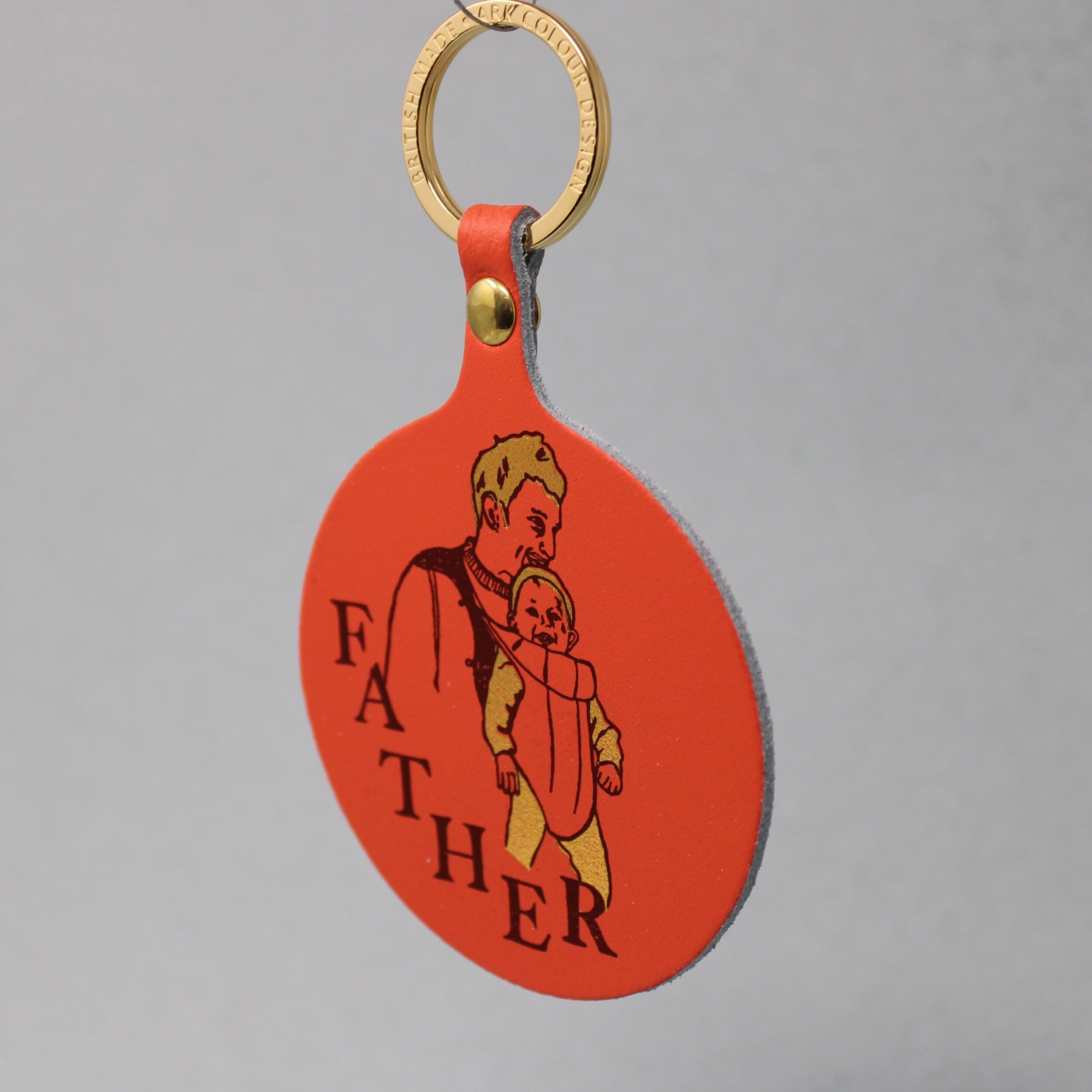 A lovely idea for a new father, a warm design for a key ring of a father and new born baby, sold by Percy Langley