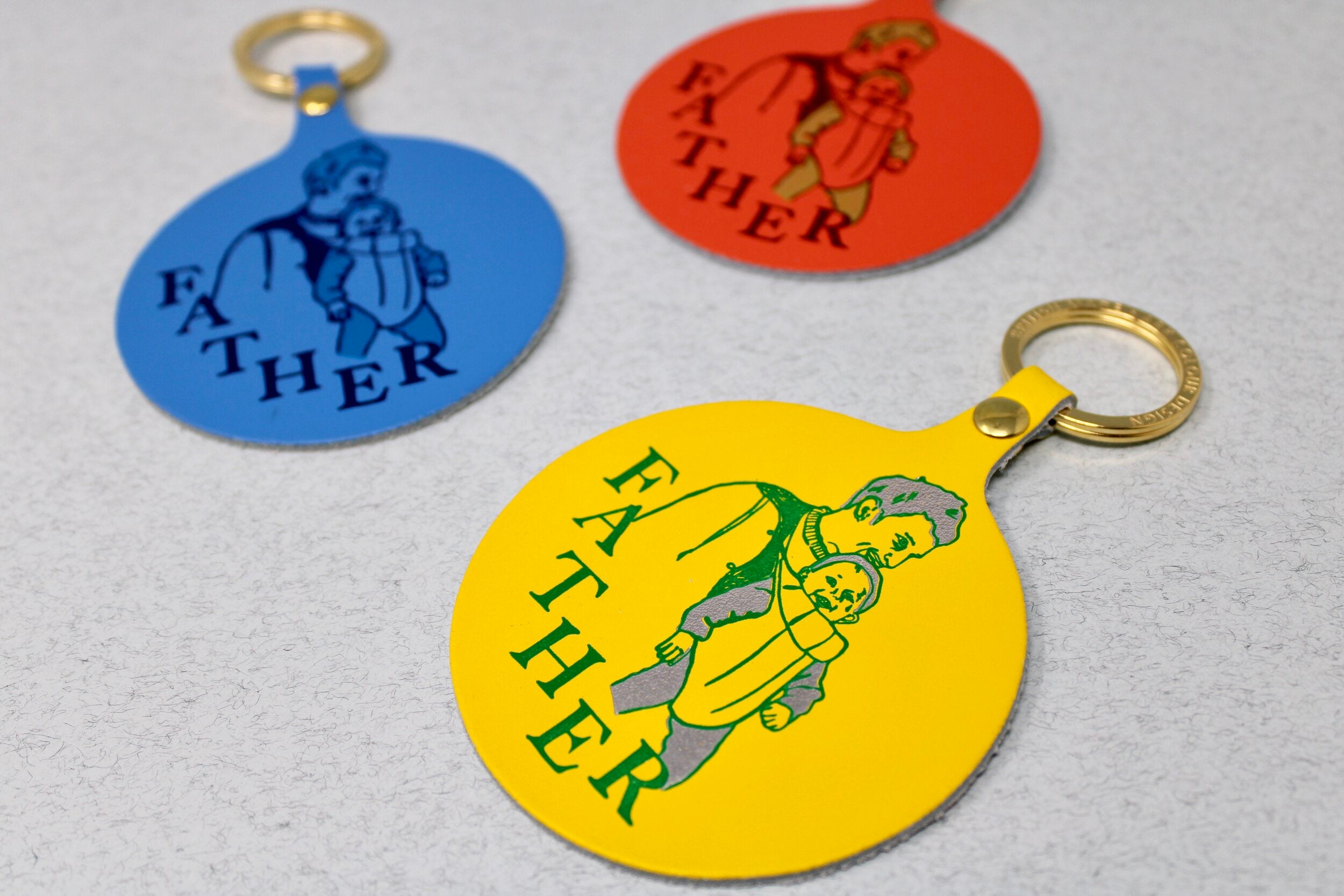 A lovely idea for a new father, a warm design for a key ring of a father and new born baby, sold by Percy Langley