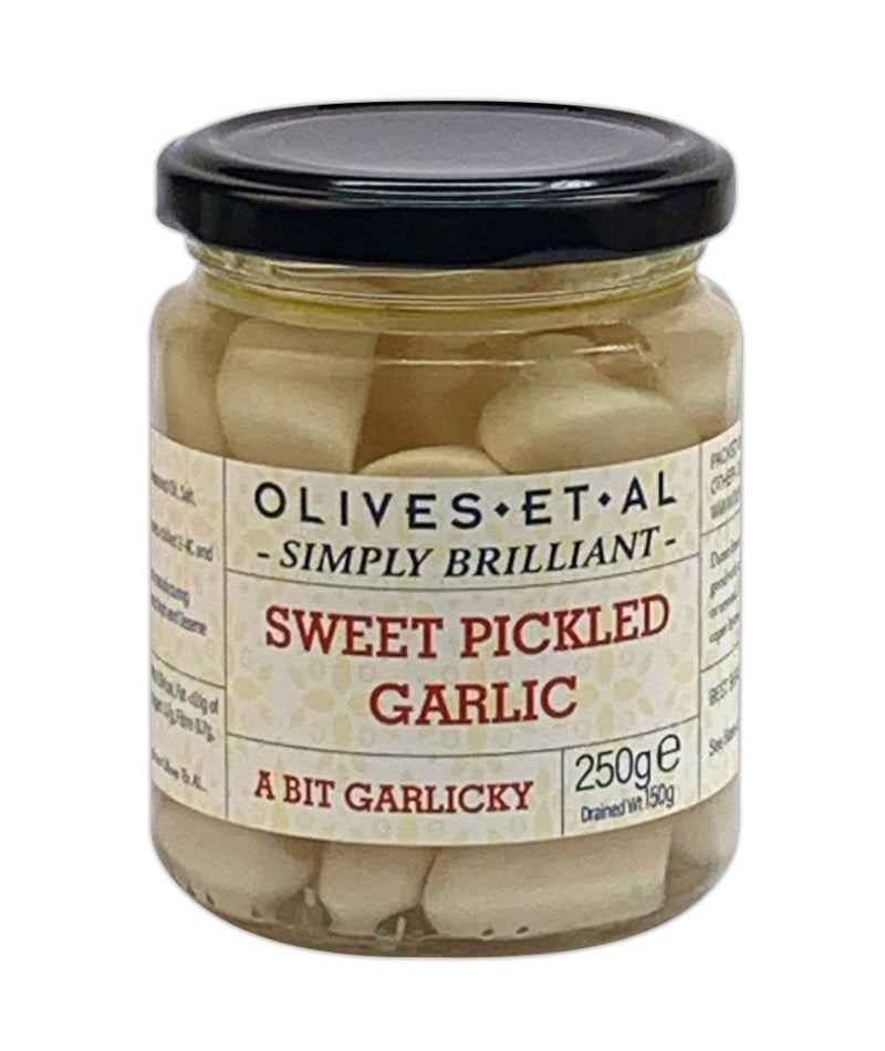 Deli counter style sweet pickled garlic, 250g jar. Fans of the Deli counter can now enjoy the Olives et Al Simply Brilliant range, designed during the pandemic by the team at Olives et Al to deliver deli food as safely as possible here jars pack all the flavour whilst staying firmly sealed. Recommend for garlic lovers to get crunching on one of natures gifts!