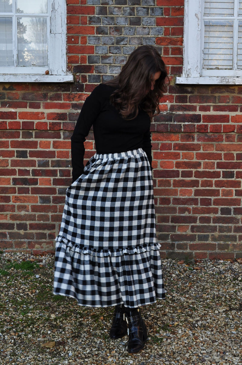 woman wearing winter gingham skirt