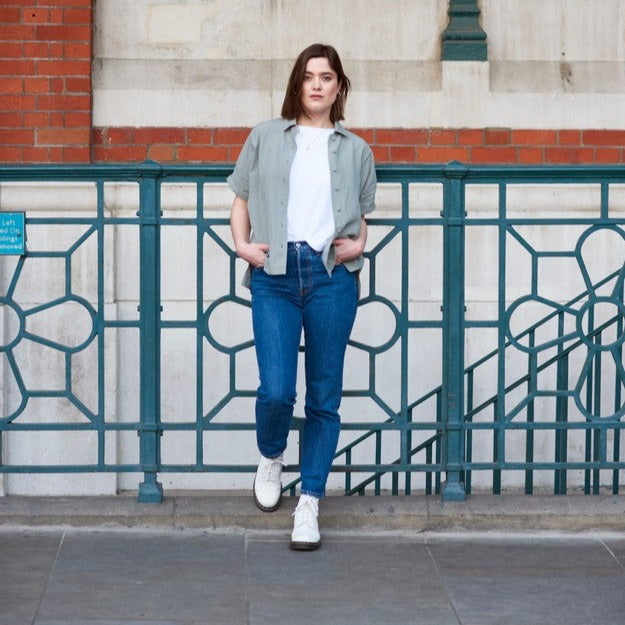 A contemporary take on the classic linen shirt.  The short-sleeved shirt design features a relaxed and comfortable fit, with a cross pleat back and flattering dropped hem. Featuring a split side seam, traditional collar, and luxurious covered buttons. This bestselling shirt is a staple for a sustainable, long-lasting wardrobe.