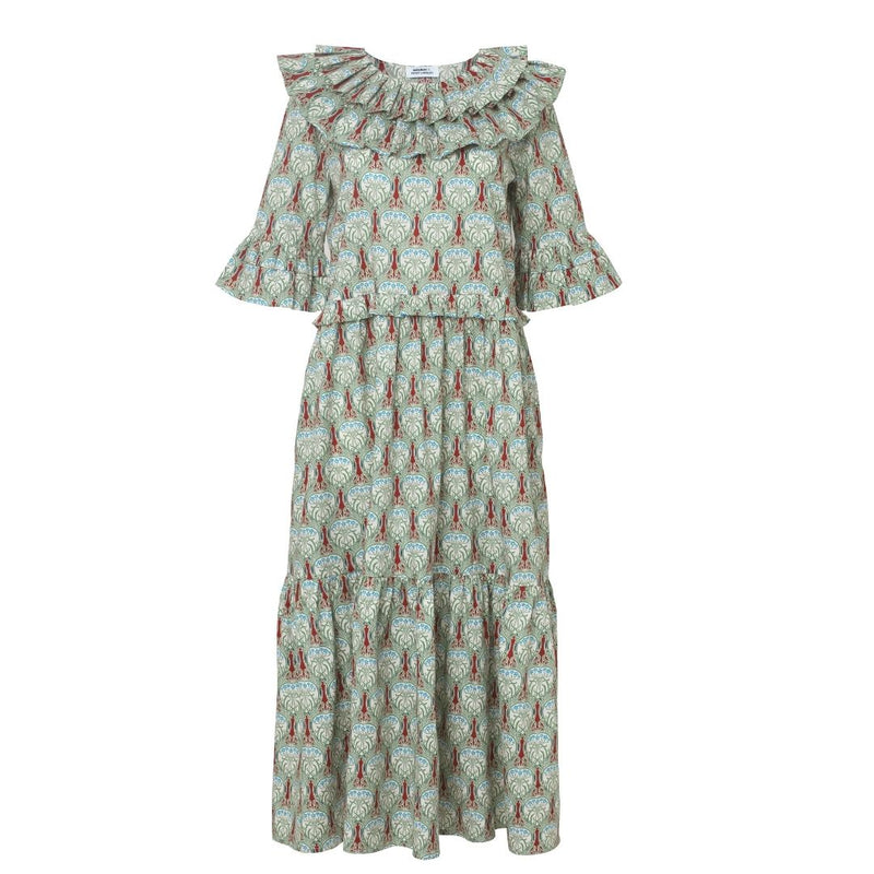 The Columbine dress has a statement frill collar, matching half sleeves and contrasting print inside the pockets.  The dress works equally well worn casually with trainers or sandals as it does with heels for an occasion.