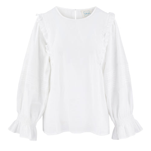  The prettiest simple white blouse this easy to wear top is made from 100% organic cotton.  The Amelie ruffle top by Dilli Grey has a relaxed fit, with delicate embroidery and statement ruffles down the sides of the blouse and around the elasticated cuffs. An absolute spring staple to wear dressed down with jeans or under dungarees, or dress it up with a skirt or pinafore dress.