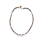 The Tourmaline Word Up necklace by Bella Riley. Exclusive to Percy Langley.  Handmade in Hackney by jeweller Bella Riley, maker of joyful Demi-fine jewellery. Bella’s designs beautifully balance classic and edgy.  Tourmaline beads in a rainbow of colours with mother of pearl letters.  Necklace is 17 inches and is finished with gold-plated clasp lined with signature neon beads and Bella Riley tag.