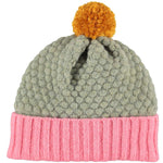 100% lambswool, handmade, children's bobble hat by Catherine Tough. Beautifully textured in honeycomb and rib knit with cute contrasting colour palette. Knitted in a traditional Scottish mill and hand-finished at their Hackney studio.