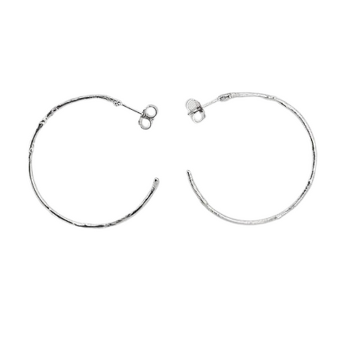 Large textured hoops made out of recycled silver by April March Jewellery. Inspired by ancient coins, keep sakes and tokens, each earring is melted, hammered and textured by hand to give them a unique character and charm. Stunning pieces of jewellery that you can dress up or down. 