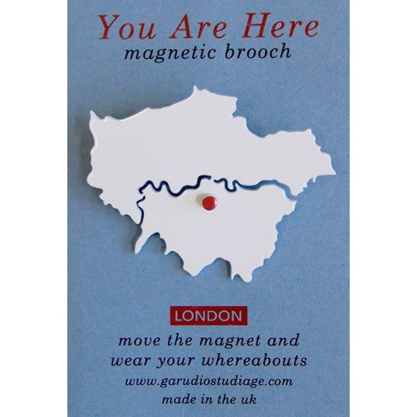 Fun brooch for young and old. Move the red enamelled magnet around the map of London as you travel Brooch: 50mm high, 0.7mm thick powder coated steel, with metal pin on the back. Card packaging: 60 x 90mm. Red enamelled magnet: 3mm diameter super strength magnet Not recommended for young children due to small parts and pin fastening.