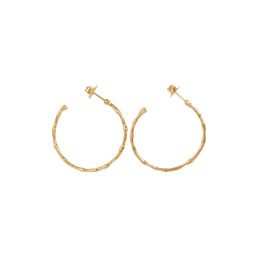 Medium textured hoops made out of fairmined gold vermeil by April March Jewellery. Inspired by ancient coins, keepsakes and tokens, each earring is melted, hammered and textured by hand to give them a unique character and charm. Stunning pieces of jewellery that you can dress up or down. 