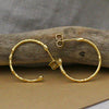Medium textured hoops made out of fairmined gold vermeil by April March Jewellery, sold by Percy Langley