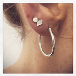 Medium textured hoops made out of recycled silver by April March Jewellery, sold by Percy Langley