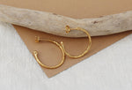 Medium textured hoops made out of recycled yellow gold by April March Jewellery, sold by Percy Langley