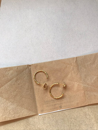 Medium textured hoops made out of recycled yellow gold by April March Jewellery, sold by Percy Langley