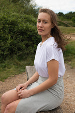 The perfect white t-shirt, comfortable with a flattering fit. The relaxed fit looks as good tucked into a pair of jeans as it does layered.   The Classic Tee by Onesta is made of a Tencel™, organic cotton and spandex blend. The all-in-one construction method not only helps to give an effortless drape when worn but also reduces production waste when cutting.  Made in Wales by Onesta. 