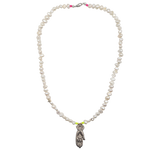 The Pearl Hand of Charity necklace by Bella Riley. Exclusive to Percy Langley.  Handmade in Hackney by jeweller Bella Riley, maker of joyful Demi-fine jewellery. Bella’s designs beautifully balance classic and edgy.  A string of freshwater nugget pearls with 18k gold-plated star and silver hand of charity pendant which symbolises giving with love.